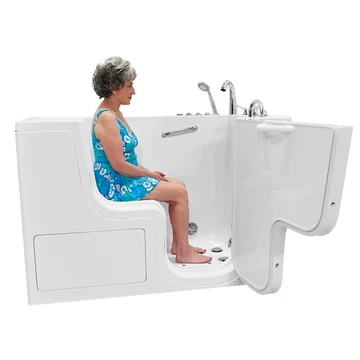 Wheelchair accessible transfer bathtub in Texas with a wide outward swing door and bather seated inside